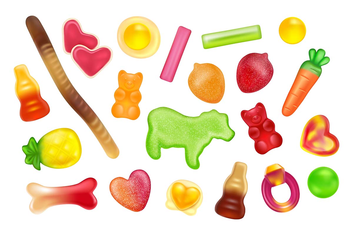 A cute, colorful variety of different gummy candies that pop off a bright, white background.